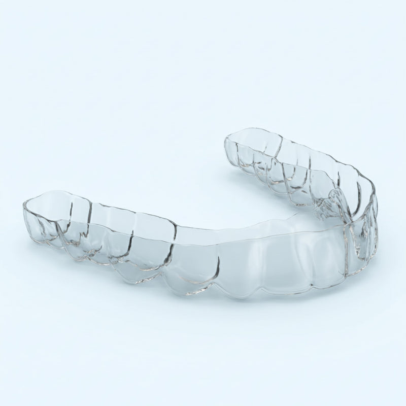 Clear upper essix retainer on light grey background