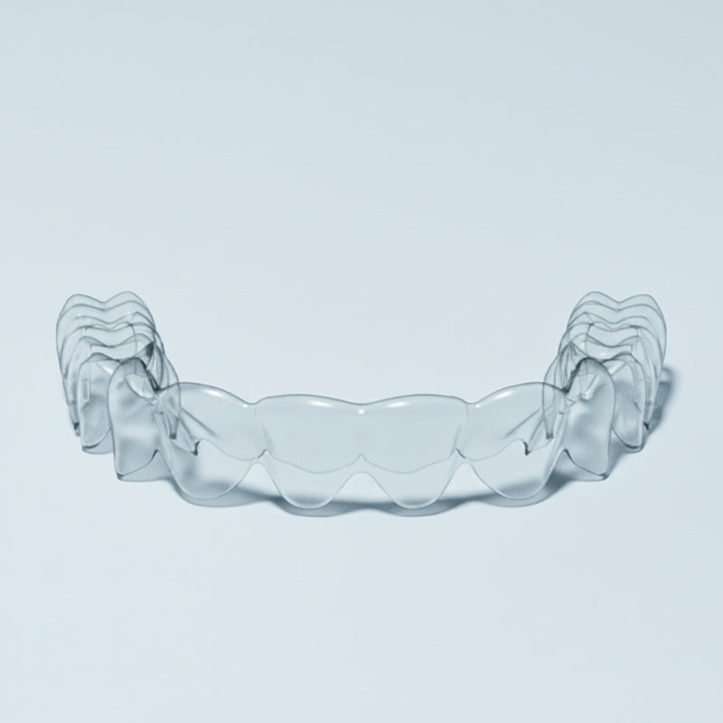 Clear upper essix retainer on blue background