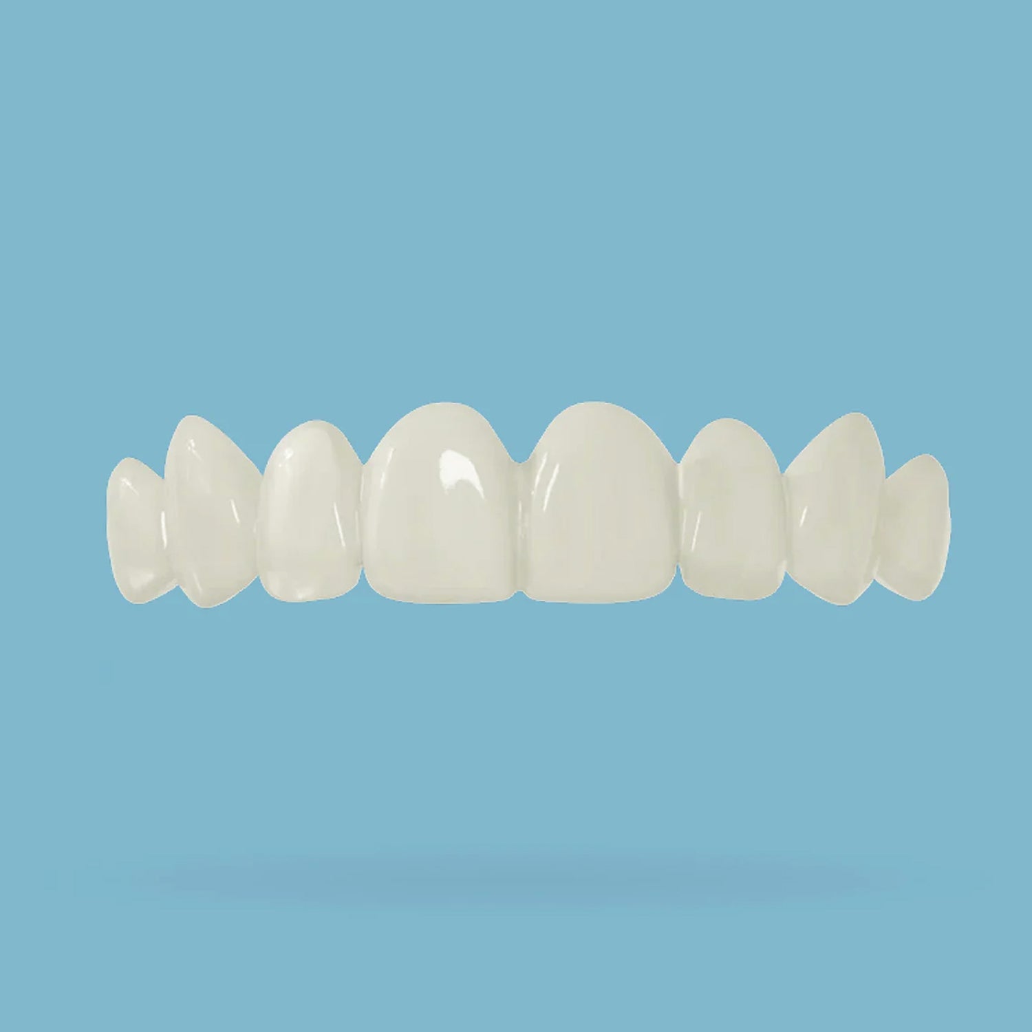 Top teeth snap on veneer on a light blue background