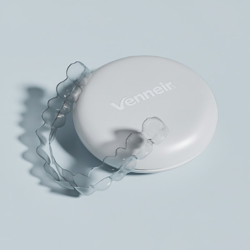 Clear upper retainer with protective storage case on light blue background