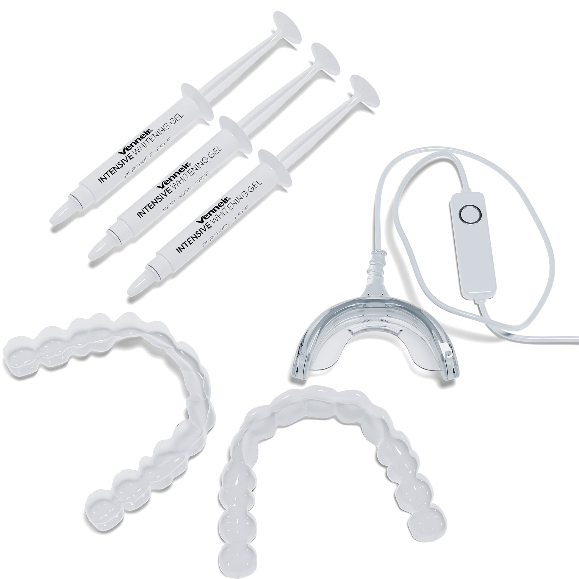 Flat-lay of teeth whitening kit with custom trays gel and LED light on white background