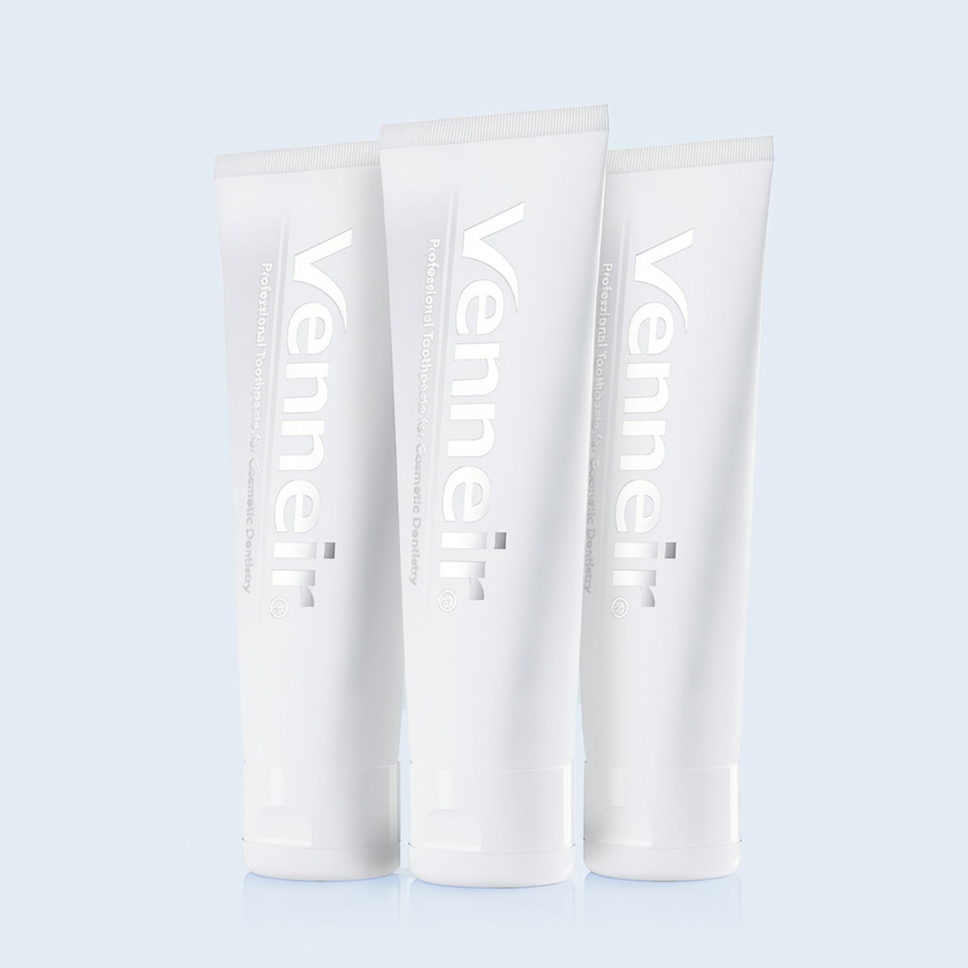 Three pack non-abrasive toothpaste for veneers composite bonding and stain removal on blue background