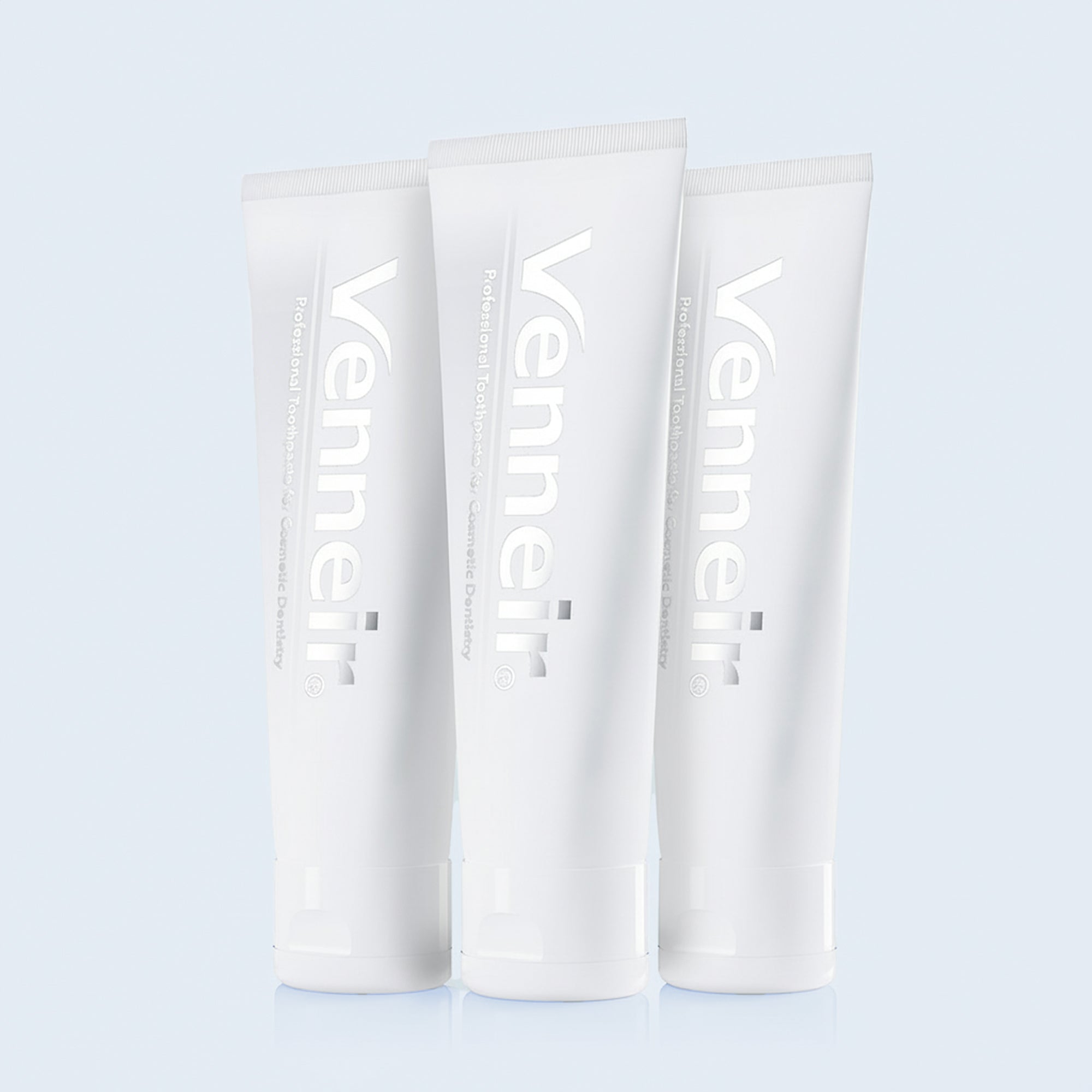 Three pack non-abrasive toothpaste for veneers composite bonding and stain removal on blue background