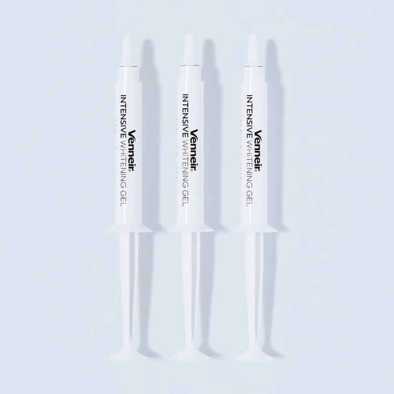 Three PAP whitening gel syringes for sensitive teeth on white background