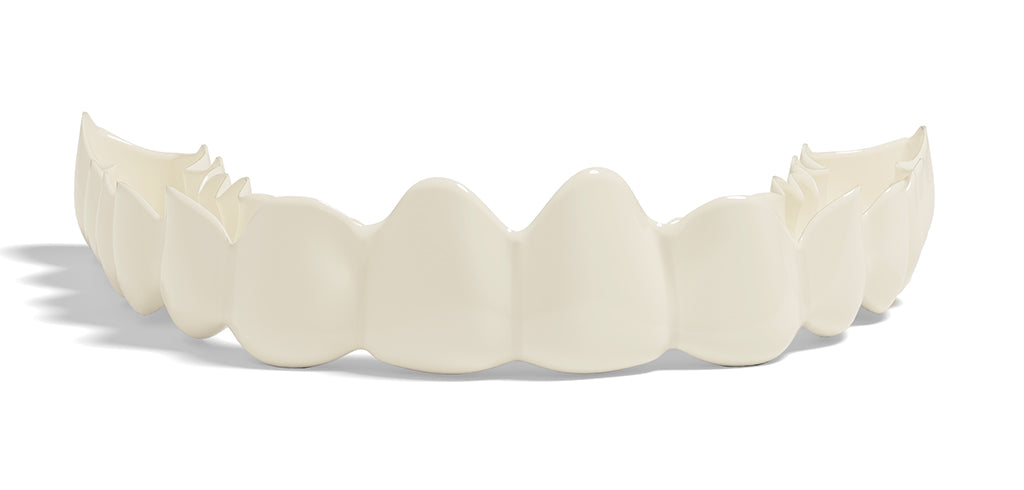 Creamy white snap on smile on a white background
