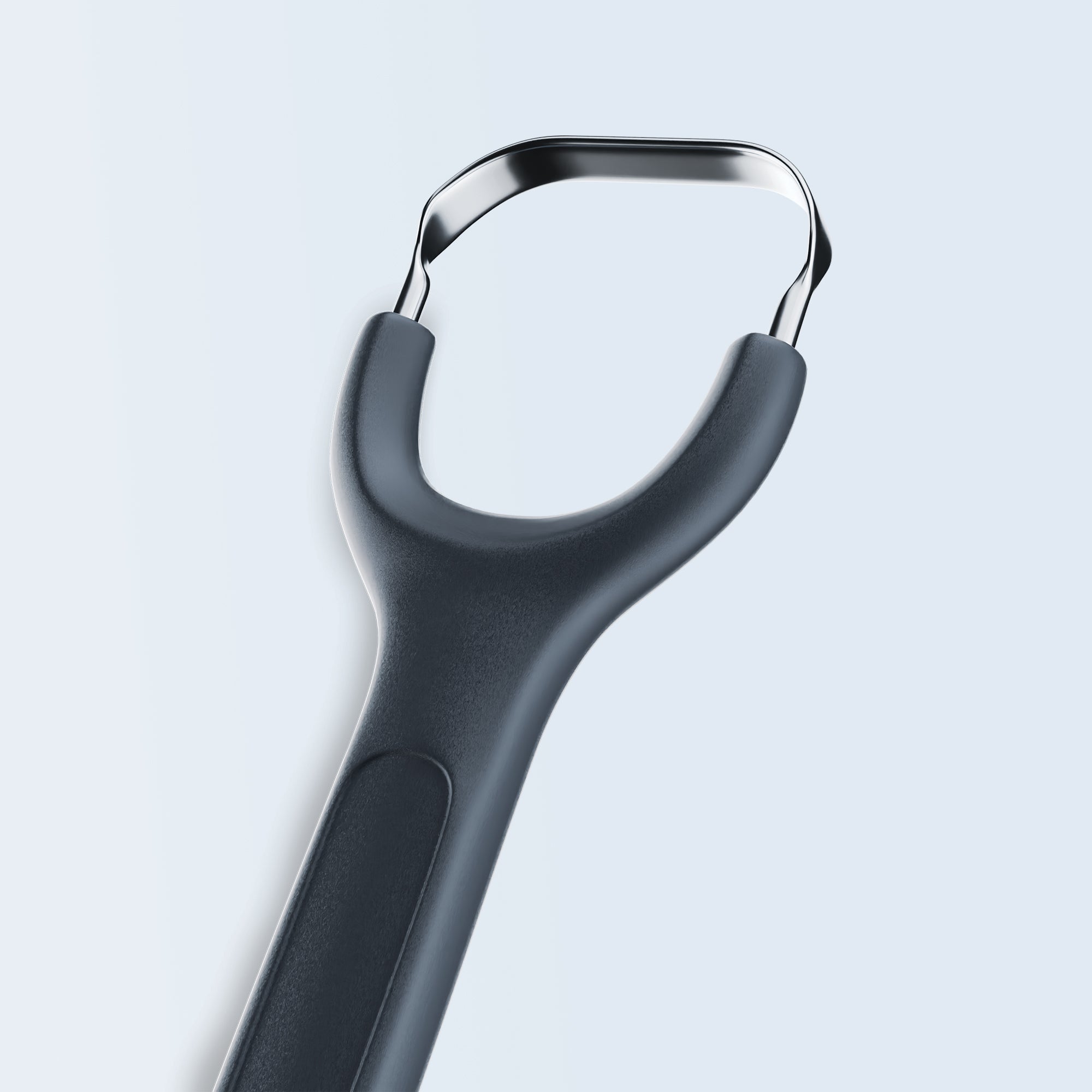 Stainless steel tongue scraper with dark grey handle on white background