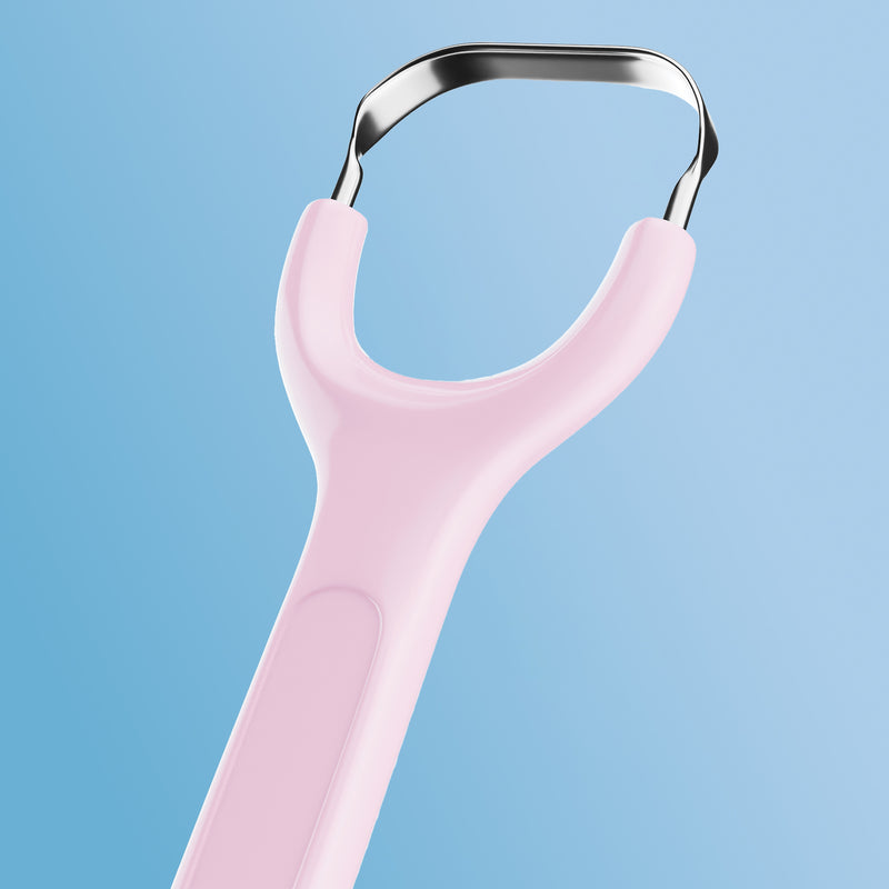 Pink Venneir tongue scraper on a light blue background