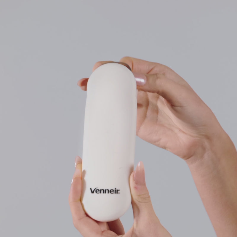 woman taking tongue scraper with pink handle out of storage case