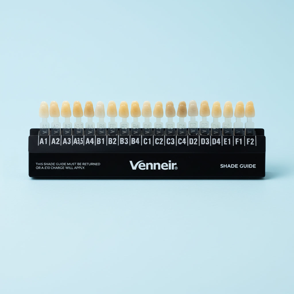 Venneir  dental shade guide with tooth color swatches on a light blue background