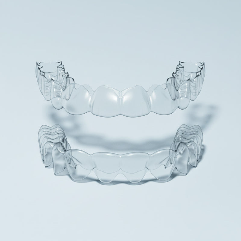 Clear upper and lower retainers on blue background