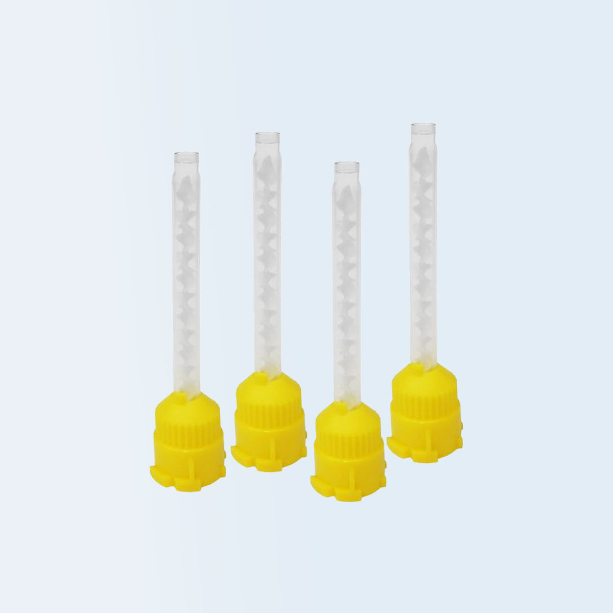 Four dental impression mixing tips with yellow base and clear top