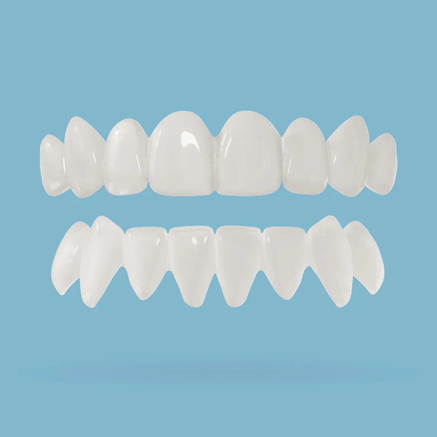 Top and bottom teeth snap on veneer on a light blue background