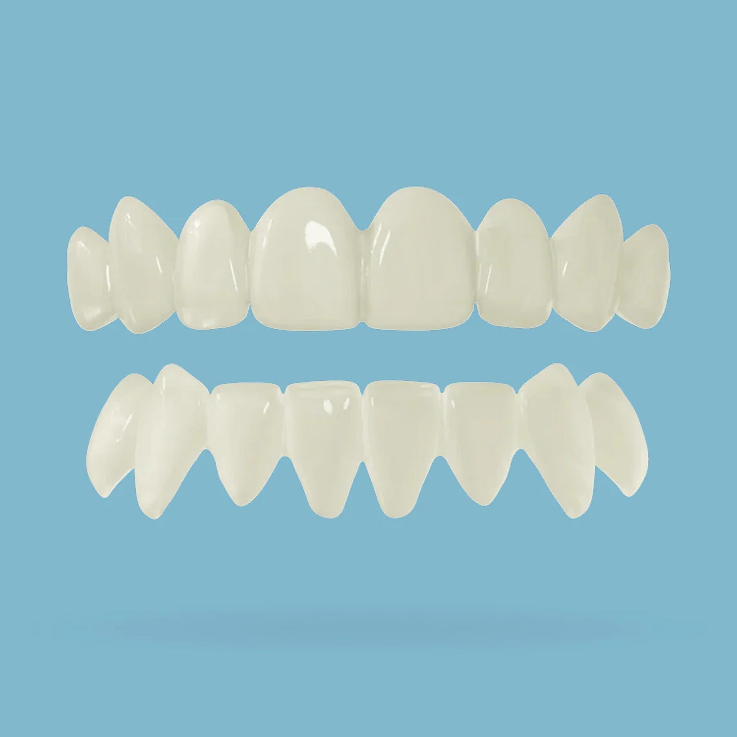 Top and bottom teeth snap on veneer on a light blue background