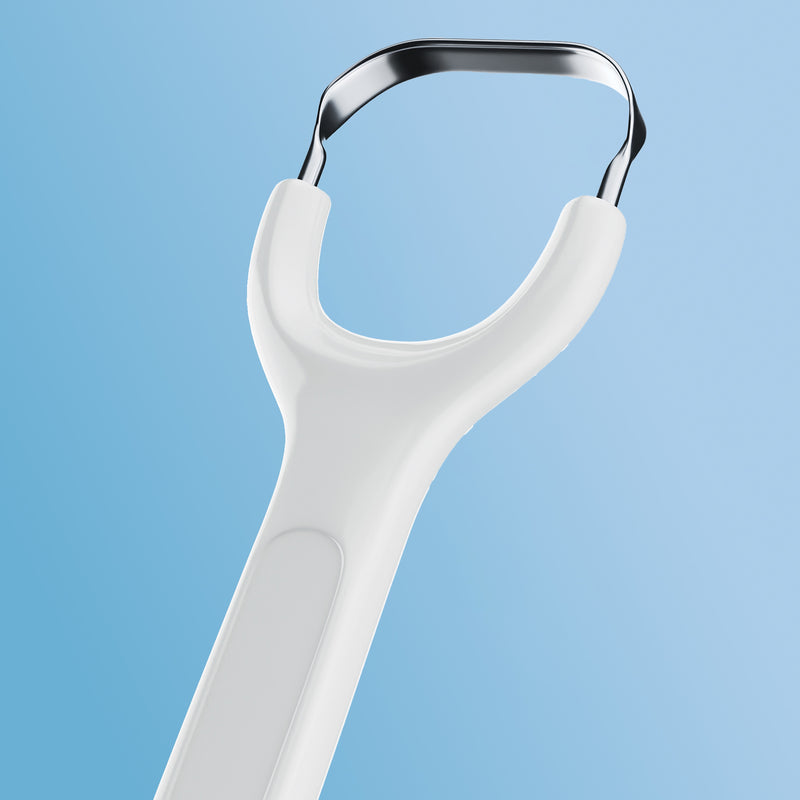 White Venneir tongue scraper on a light blue background